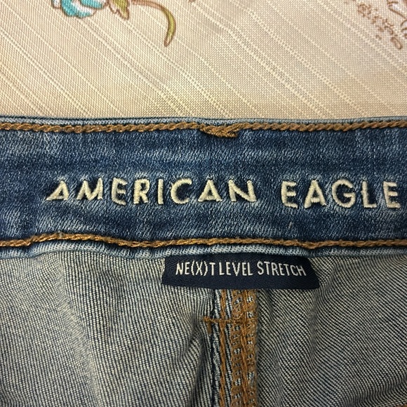 Size 8 American Eagle rolled stretch denim shorts with frayed patches. - Picture 3 of 5